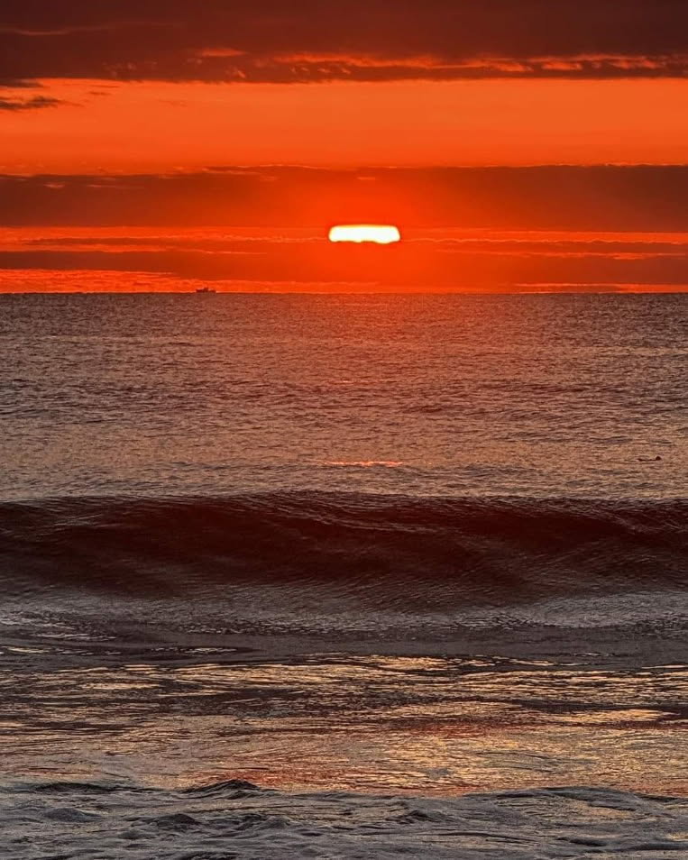 Golden-hour sunset over the ocean — the kind of quiet we try to bottle